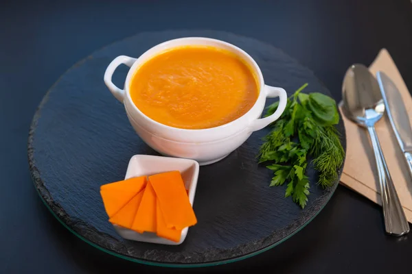 Bowl of healthy butternut soup with herbs — Stockfoto