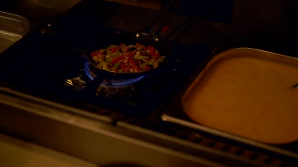 Vegetables cooking in a pan for an egg omelette — Stock Video