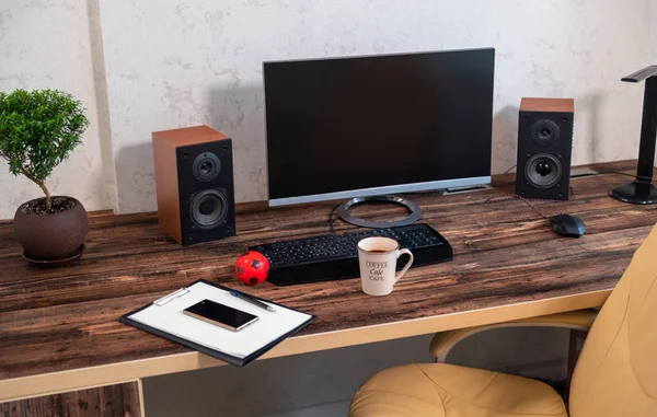 Neat desk and workstation in an office