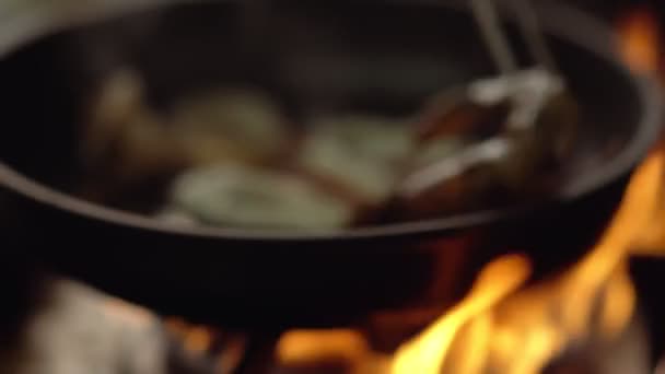 Calamari rings cooking in a frying pan — Stock Video