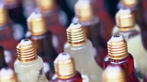 Innovative bottles of fruit juice shaped like bulb — Stock Video