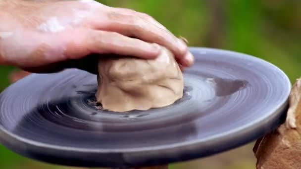 Man working with a lump of wet clay — Stock Video