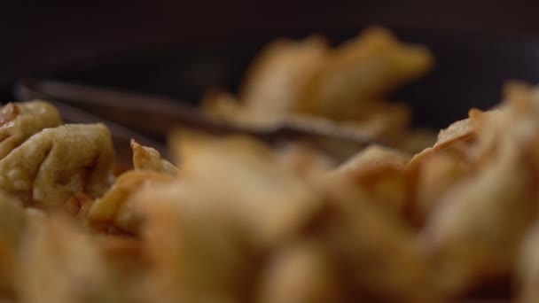 Shift focus texture of golden fried pastries — Stock Video