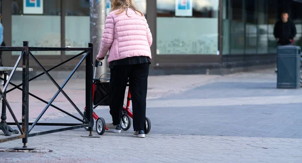 Disabled person using a walking frame — Stock Photo, Image