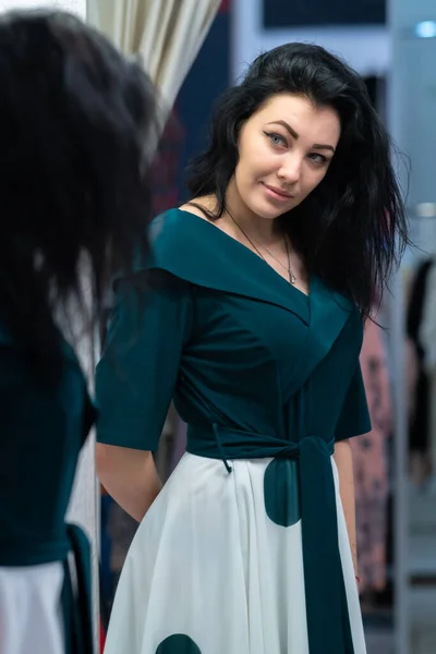 Attractive Woman Trying Decide Whether Buy Stylish New Outfit Boutique — Stock Photo, Image