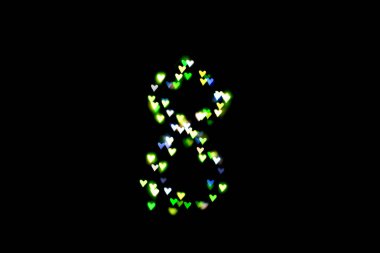 Şekil 8 siyah bir arka plan üzerinde renkli bir bokeh oluşturulmuş. Dünya Kadınlar günü. 8 Mart.