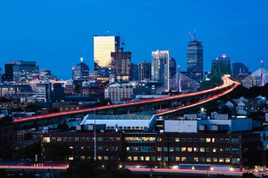 Boston city skyline with Boston bridges and highways at dusk, Boston Massachusetts USA clipart