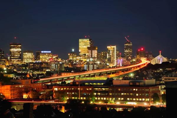 Boston city skyline with Boston bridges and highways at dusk, Boston Massachusetts USA