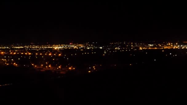 Blurred City Lights View Landing Aircraft Window — Stock Video