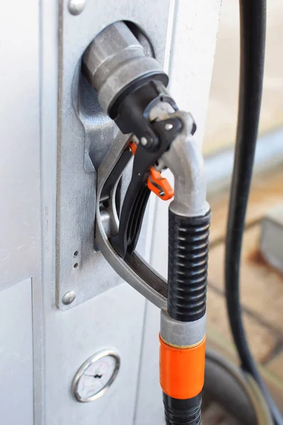 Natural gas pistol pump for refuel gas in car in gas station. Alternative energy concept.