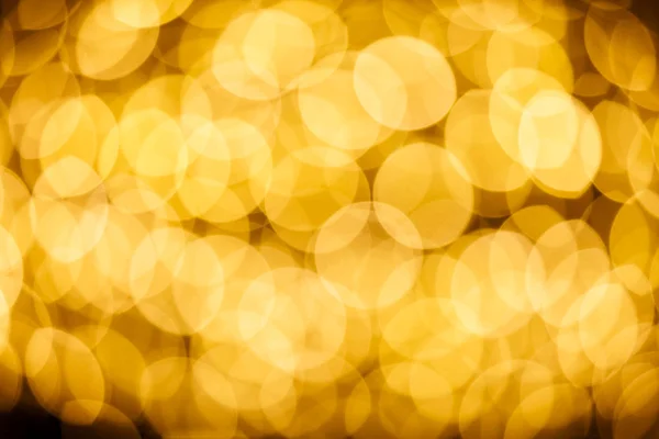 ゴールドカラーボケライトのぼかし背景 — ストック写真