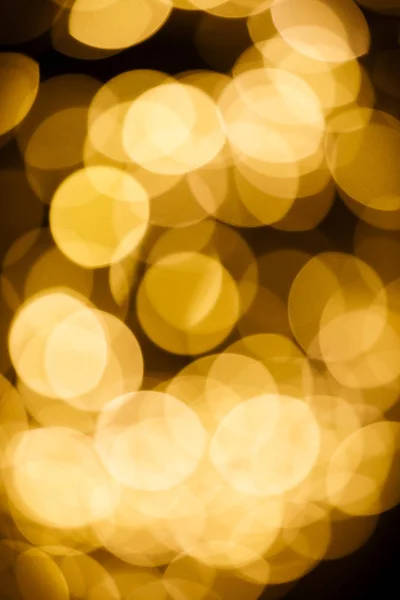 ゴールドカラーボケライトのぼかし背景 — ストック写真