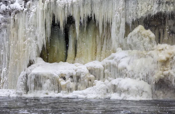 Icicles on frozen waterfall in winter — Stock Photo, Image
