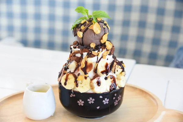 Bingsu Food shaved ice dessert with sweet toppings and fruit and varieties with ingredients, popular dessert,Bingsu Thailand , Chocolate Brownie with Ice cream and fudge
