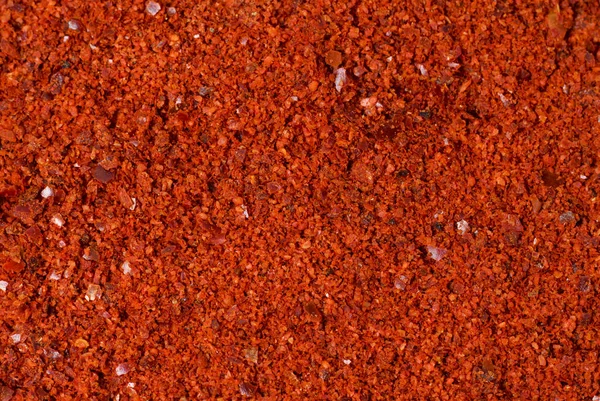 Pimenta vermelha moída close-up, textura, fundo — Fotografia de Stock