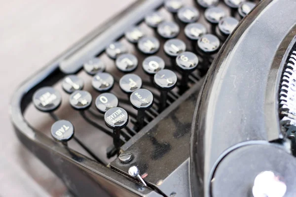 Black typewriter close-up, top view — Stock Photo, Image