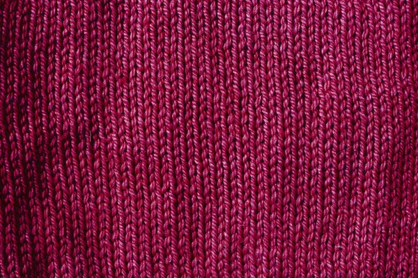 Trend red pear woolen knitted background, texture, close-up — Stock Photo, Image