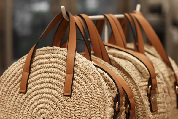 Round Straw trend bags close-up in the store