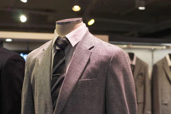 Gray jacket close-up front view, in the men\'s clothing store.
