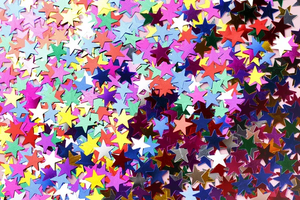Tarka csillagok a konfetti közeli, felülnézet, másolási tér — Stock Fotó