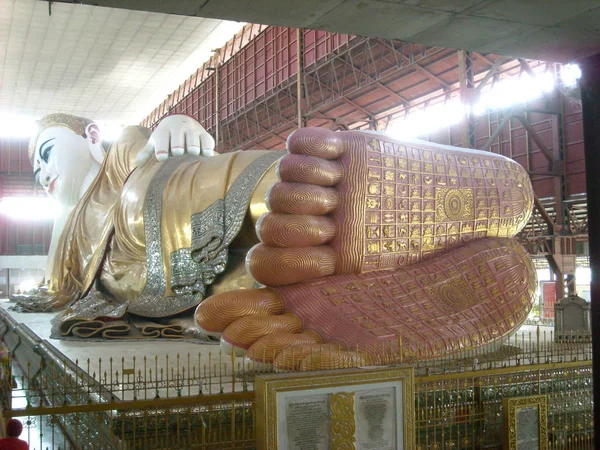 a big statue in a temple in burma