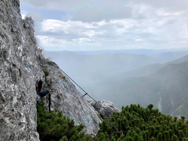 a rope on the rock for climbing on it