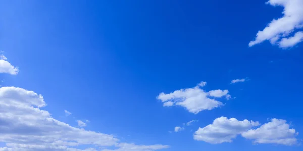 Wide blue sky with white weightless cloud on beautiful sunny day.Horizontal backdrop,banner for website,text.Copy space — Stock Photo, Image