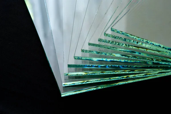 Sheets of Factory manufacturing tempered clear float glass panels cut to size.