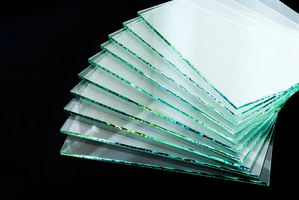 Sheets of Factory manufacturing tempered clear float glass panels cut to size.