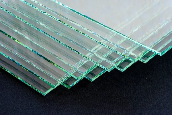 Sheets of Factory manufacturing tempered clear float glass panels cut to size.