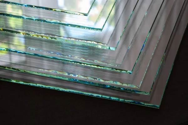 Sheets of Factory manufacturing tempered clear float glass panels cut to size.