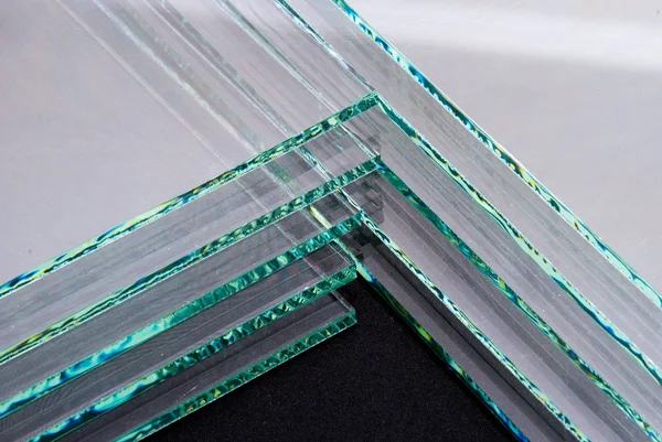 Sheets of Factory manufacturing tempered clear float glass panels cut to size.