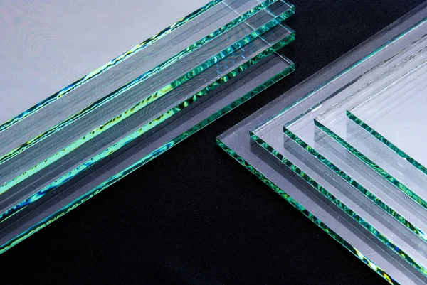 Sheets of Factory manufacturing tempered clear float glass panels cut to size.