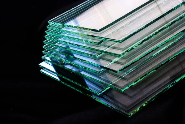 Sheets of Factory manufacturing tempered clear float glass panels cut to size.