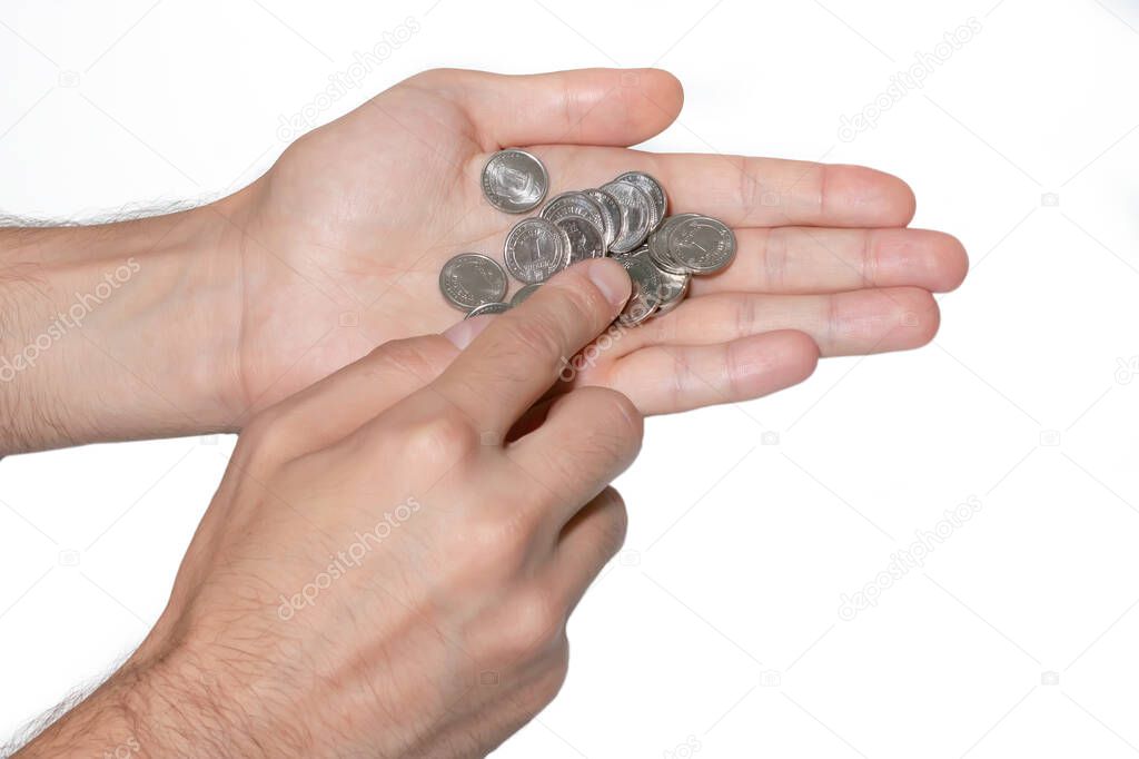 Coins in hands. Hand holding coins. Ukrainian money.