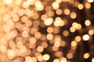 Dikey arkaplan için mükemmel bir bokeh. Sarı-beyaz yuvarlak bokeh. Bokeh sağa sola dağıtıldı..