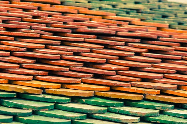 Roof tiles are made of clay layers that are stacked in multiple layers.