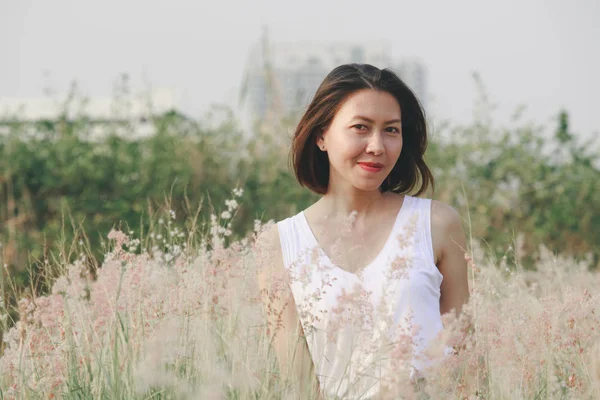 Woman Sitting Grass Field Happy Smile Swaying Hair — 스톡 사진