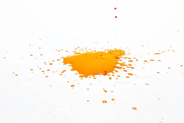 Oranje Waterdruppels Spatten Een Witte Achtergrond — Stockfoto