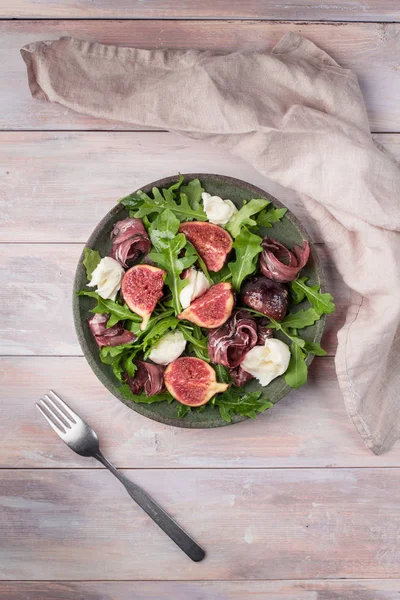 Marinated figs with mozzarella and serrano ham