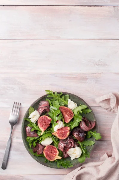 Marinated figs with mozzarella and serrano ham