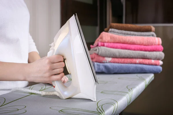 Young woman ironing clothes. Close up — Stockfoto