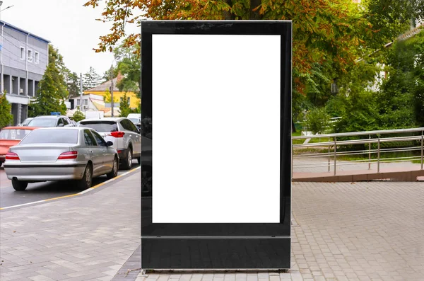 advertising space under the poster. Lightposter citylight mockup small billboard in the city near the roadway. white space for advertising
