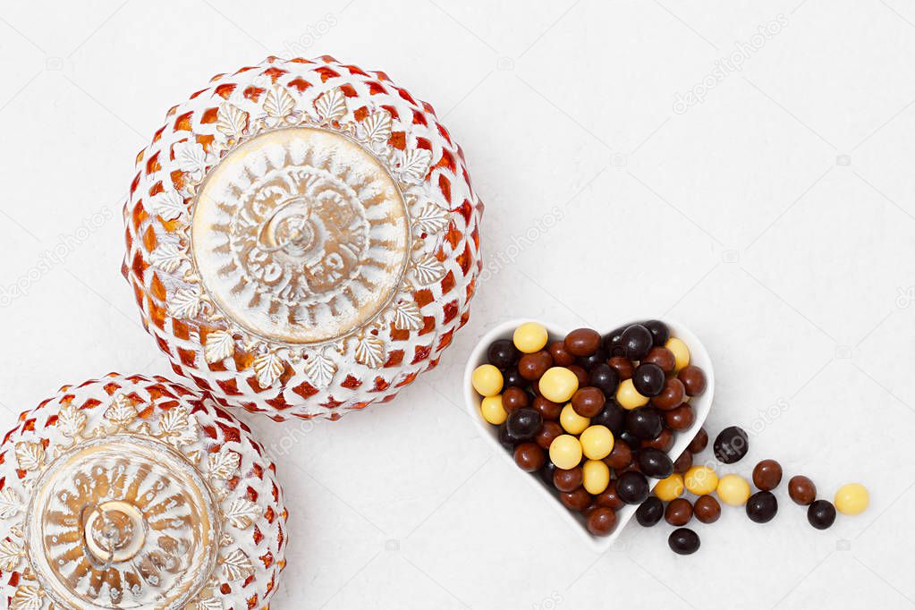 Eid Mubarak greeting with Eid Al Adha sacrifice festival, Islamic Arabic candle and sweet chocolate sugar