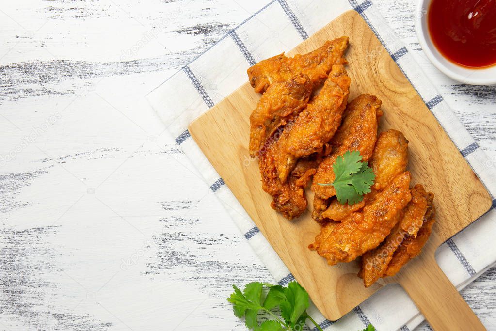 Fried chicken wings on wooden board. breaded crispy chicken serve with