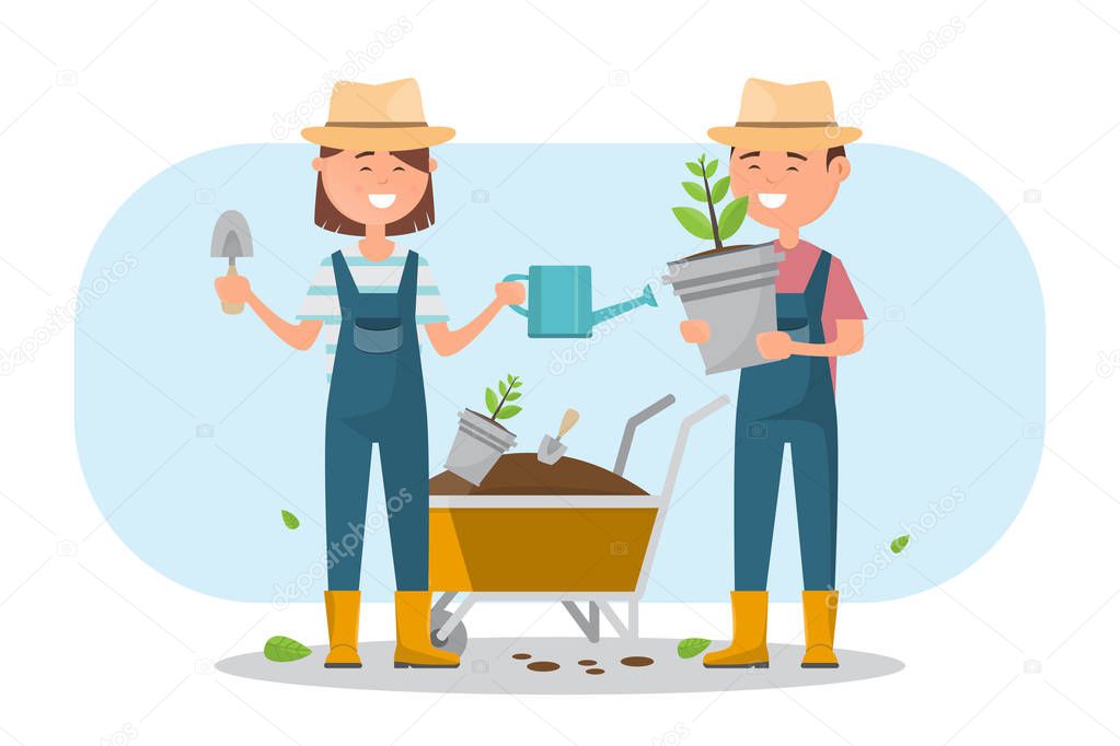 happy boy and girl planting a tree outdoors