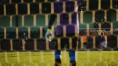 Futbol oyun, oyuncular bulanık topu ile çalışan