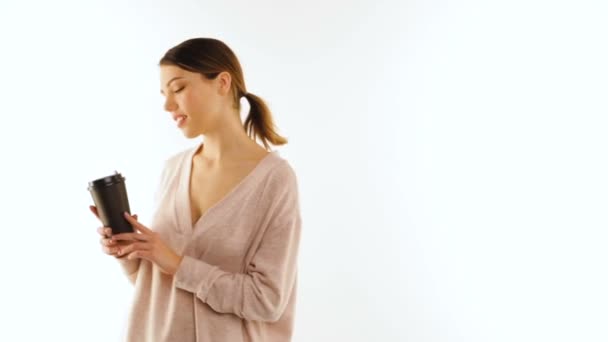 Smiling girl with a cup of coffee, isolated — Stock Video