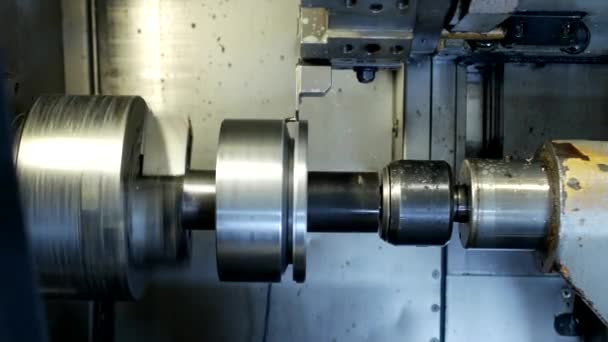 CNC lathe pulls out part of metal workpiece pulley, modern lathe for metal processing, close-up, turning — Stock Video