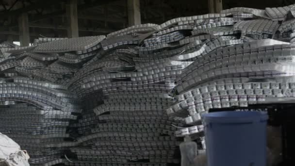 Storage room of plastic cans in recycling factory — Stock Video